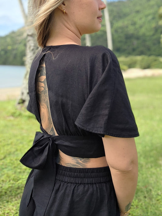 Women's tie back linen top in black. Versatile feminine linen design for elegant evenings and elevated everyday wear.