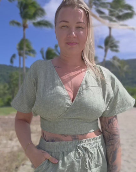 Women's pure linen beach wear. Natural fibres for summer style. V-neck design for effortless elegance.