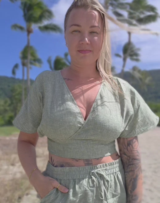 Women's pure linen beach wear. Natural fibres for summer style. V-neck design for effortless elegance.