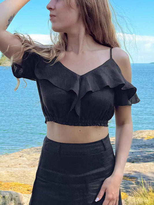 Women's cropped ruffle top in pure linen. Soft elastic waistband creates effortlessly elegant feminine silhouette. 